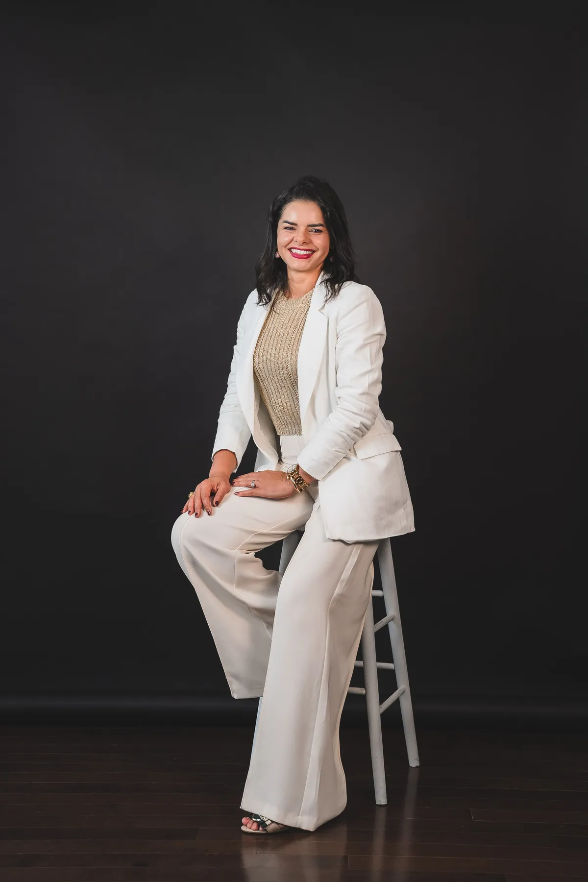 Elaine, founder of LanexPro, seated portrait.